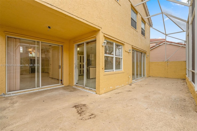 view of patio / terrace with a lanai