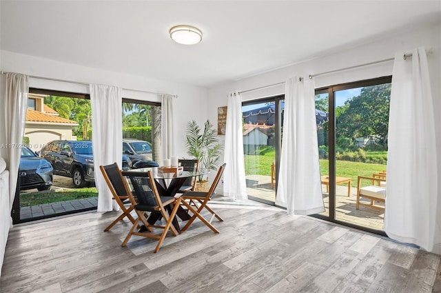 dining area with wood finished floors