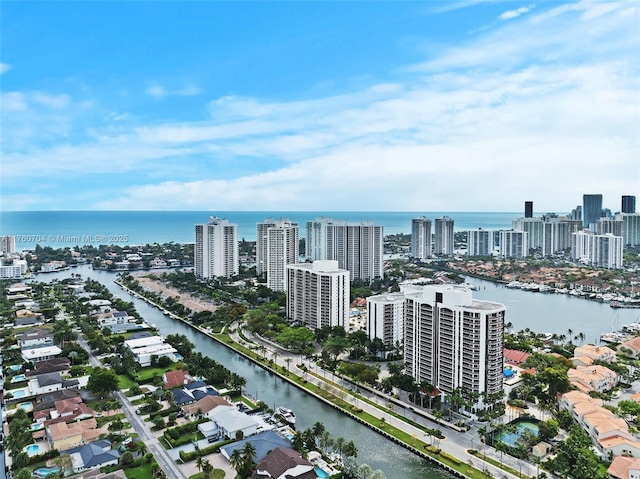 birds eye view of property featuring a view of city and a water view