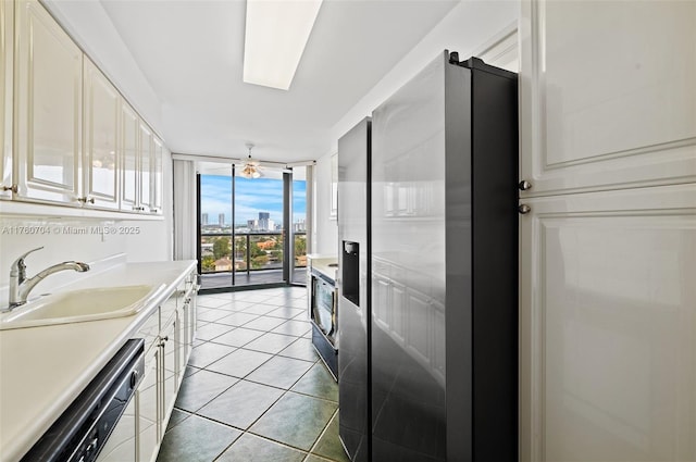 3600 Yacht Club Dr Unit 1102, Aventura, FL 33180 - kitchen with dishwashing machine, light tile patterned floors, stainless steel fridge with ice dispenser, a sink, and floor to ceiling windows