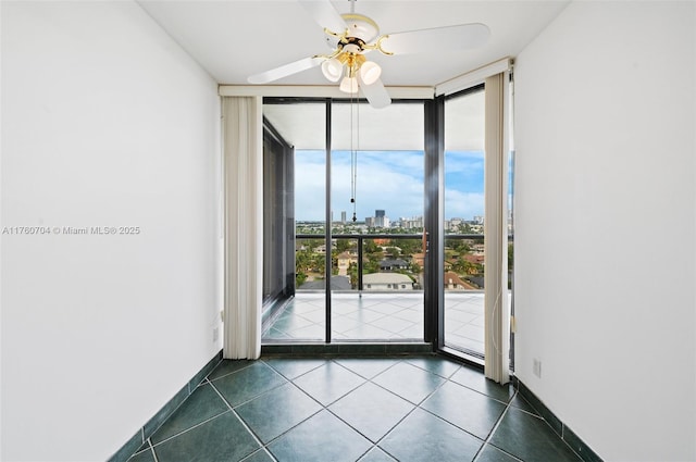 3600 Yacht Club Dr Unit 1102, Aventura, FL 33180 - spare room with dark tile patterned flooring, a city view, a ceiling fan, expansive windows, and baseboards