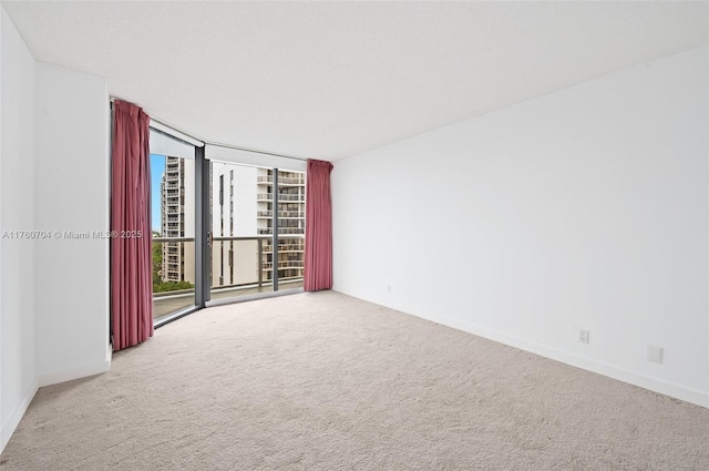 3600 Yacht Club Dr Unit 1102, Aventura, FL 33180 - carpeted spare room featuring expansive windows and baseboards