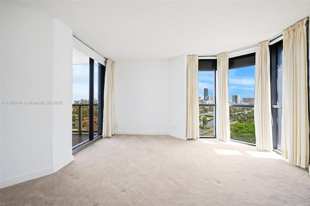 3600 Yacht Club Dr Unit 1102, Aventura, FL 33180 - carpeted spare room with a city view, baseboards, and expansive windows