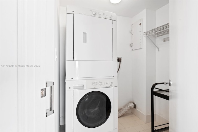 3600 Yacht Club Dr Unit 1102, Aventura, FL 33180 - clothes washing area with stacked washer and clothes dryer, light tile patterned flooring, and laundry area