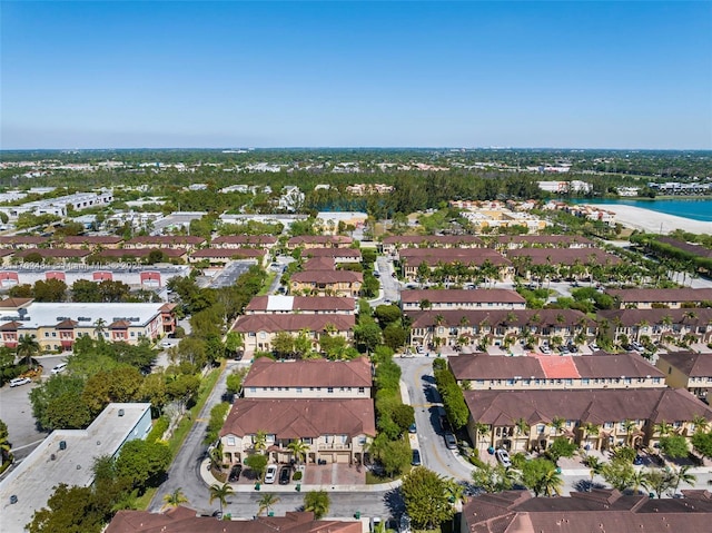 birds eye view of property featuring a residential view and a water view