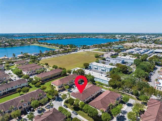 bird's eye view with a residential view and a water view