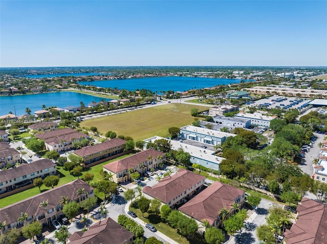 birds eye view of property with a residential view and a water view