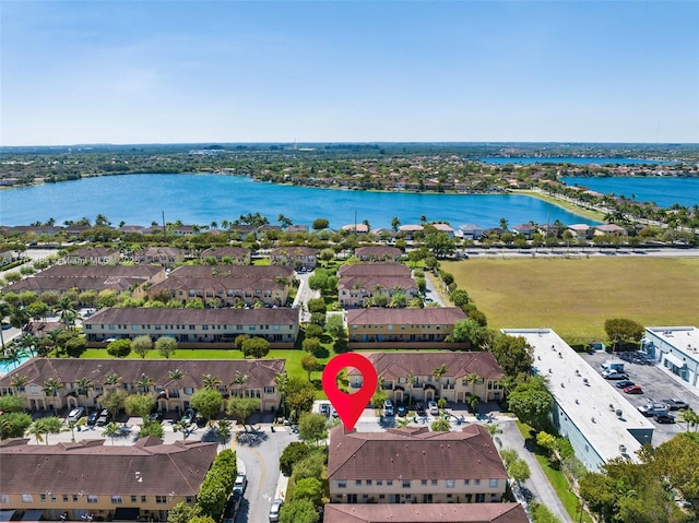 aerial view with a residential view and a water view