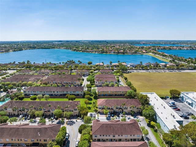 birds eye view of property with a residential view and a water view