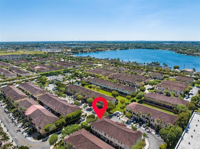 bird's eye view with a residential view and a water view