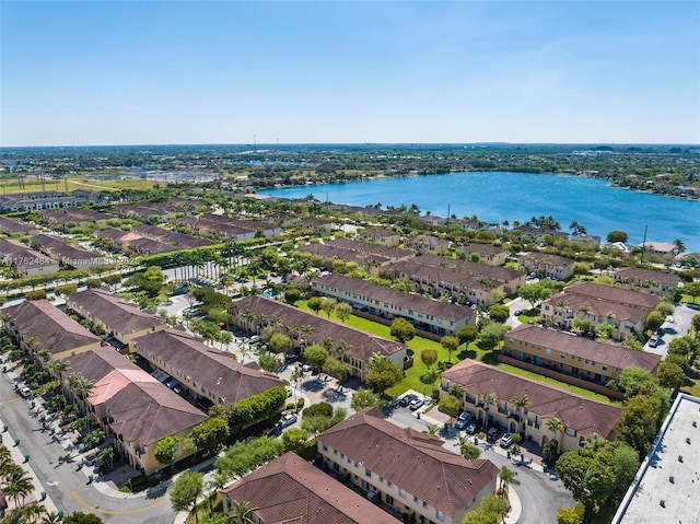 birds eye view of property with a residential view and a water view