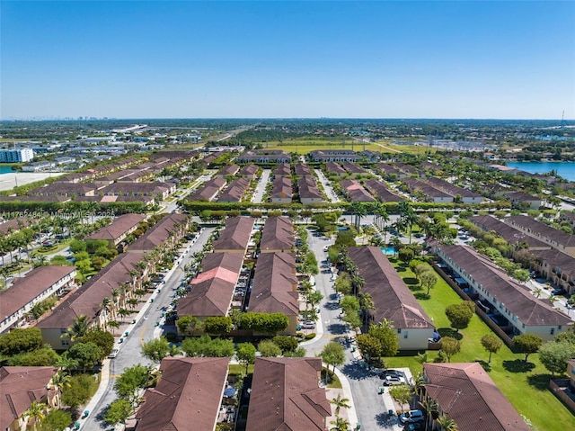 bird's eye view with a residential view and a water view