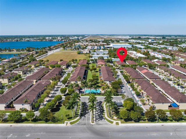 bird's eye view with a residential view and a water view