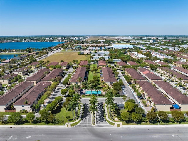 bird's eye view featuring a water view and a residential view