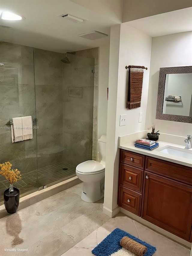 bathroom featuring vanity, visible vents, a stall shower, tile patterned flooring, and toilet