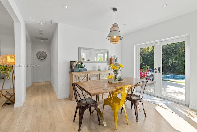 dining area featuring recessed lighting, french doors, light wood-style flooring, and baseboards