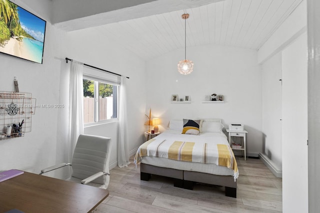 bedroom featuring baseboards, wood ceiling, light wood-style flooring, and vaulted ceiling