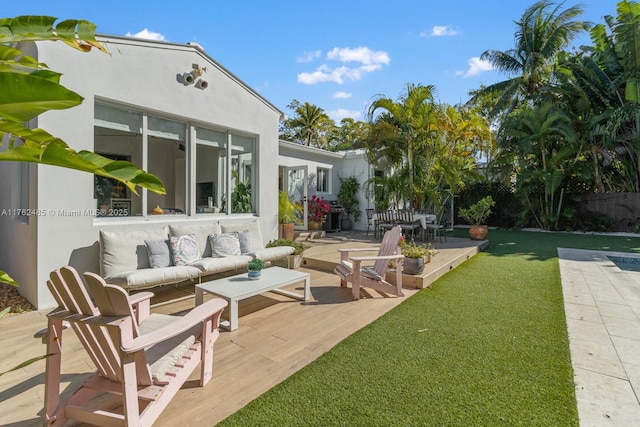 view of yard featuring an outdoor living space, a patio area, and fence