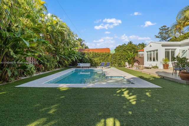 pool with a yard, a patio, and a fenced backyard