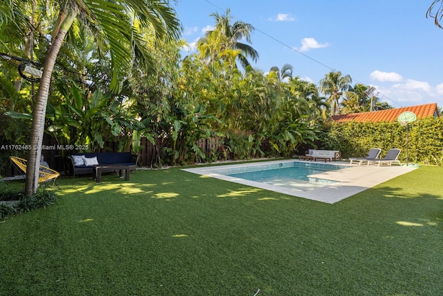 outdoor pool featuring a yard, an outdoor hangout area, and a patio