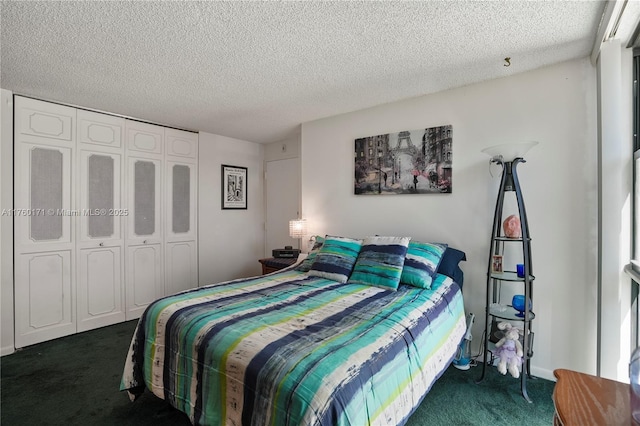 bedroom with a closet, dark carpet, and a textured ceiling