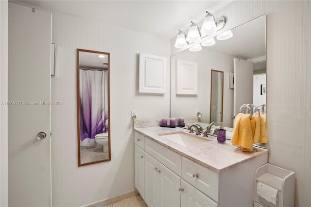 full bathroom featuring vanity and toilet