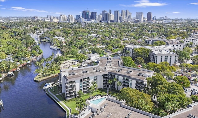 birds eye view of property featuring a water view and a city view