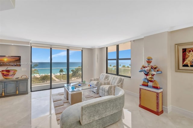 living area featuring plenty of natural light, a water view, baseboards, and expansive windows