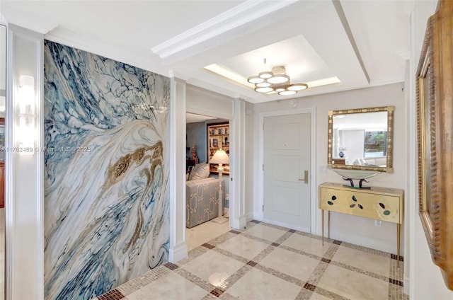 interior space featuring a tray ceiling and ornamental molding