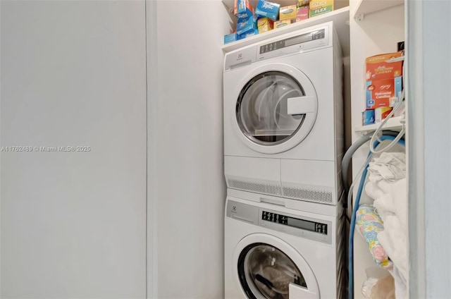 laundry room featuring laundry area and stacked washer and dryer