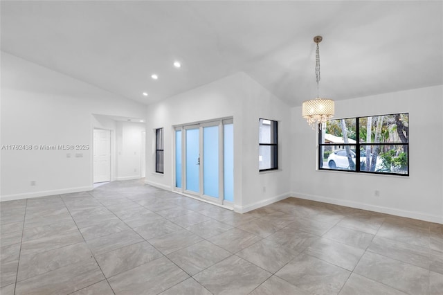 spare room with recessed lighting, baseboards, an inviting chandelier, and vaulted ceiling