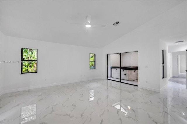 empty room with visible vents, marble finish floor, and ceiling fan