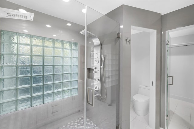 full bathroom with tile patterned floors, recessed lighting, a stall shower, and toilet