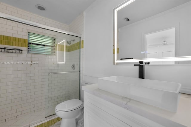 bathroom with visible vents, toilet, a stall shower, ornamental molding, and vanity