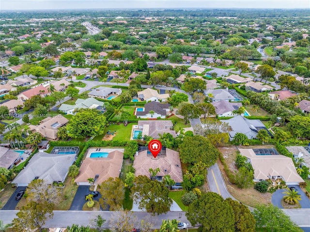 birds eye view of property with a residential view