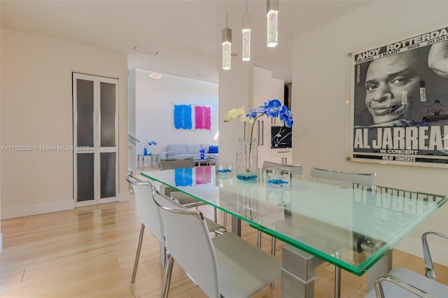 dining room featuring baseboards and wood finished floors