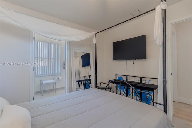 bedroom featuring wood finished floors