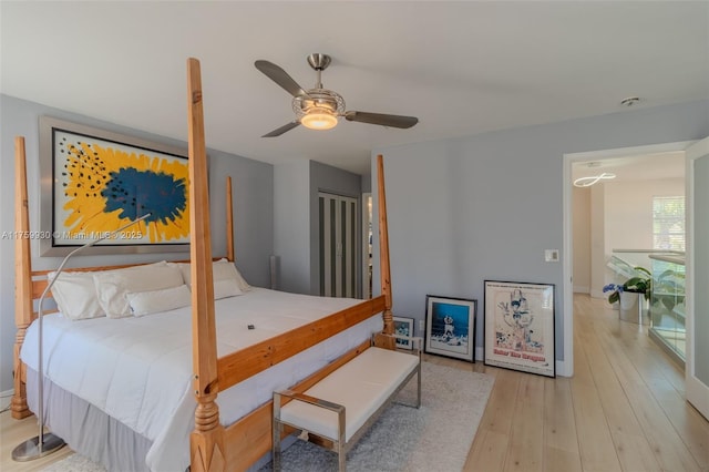 bedroom with ceiling fan and wood finished floors