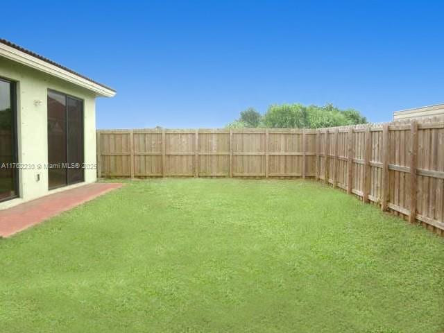 view of yard featuring a fenced backyard