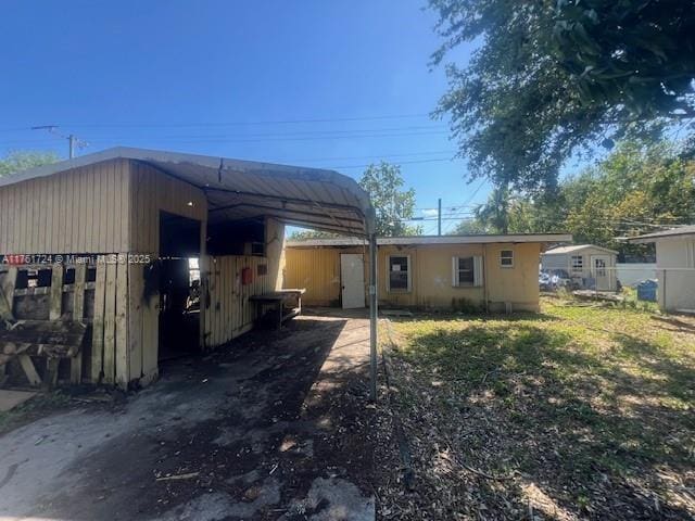 rear view of house featuring fence