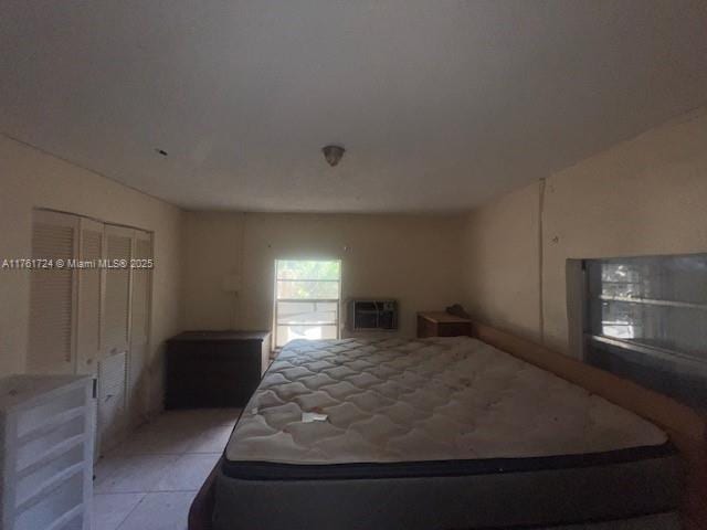 unfurnished bedroom featuring light tile patterned flooring