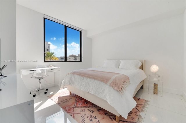 bedroom featuring baseboards