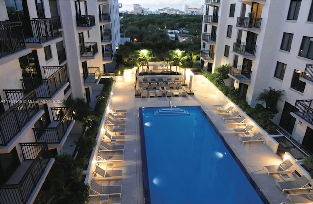 view of swimming pool featuring a city view