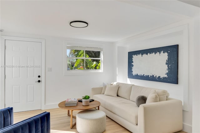 living room with light wood-style floors and baseboards