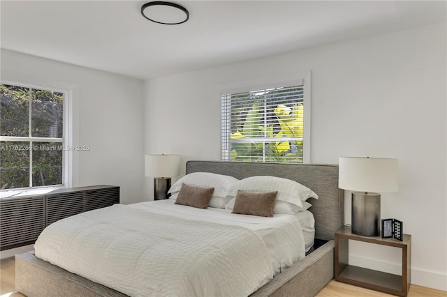 bedroom featuring wood finished floors