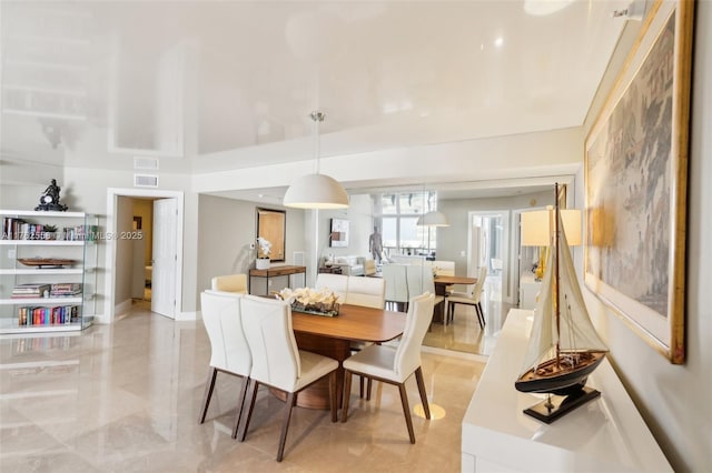 dining space featuring visible vents