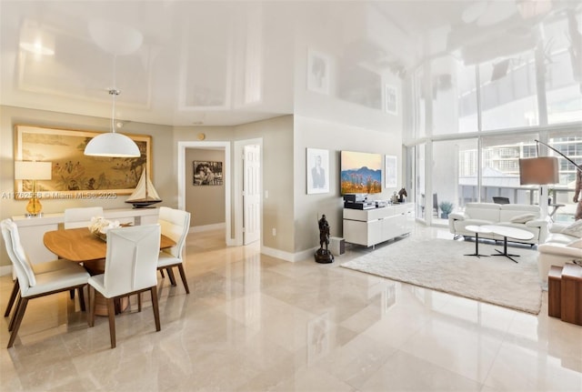 16711 Collins Ave Unit 704, Sunny Isles Beach, FL 33160 - dining area with baseboards