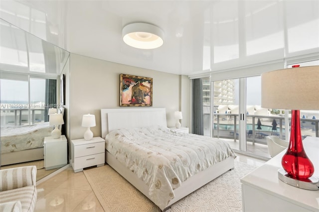 16711 Collins Ave Unit 704, Sunny Isles Beach, FL 33160 - bedroom featuring light tile patterned flooring and access to exterior