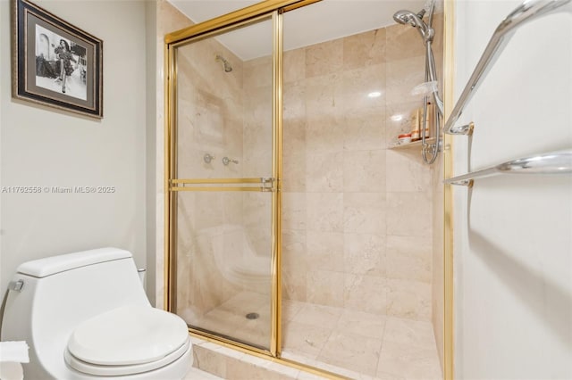 full bathroom with a shower stall and toilet