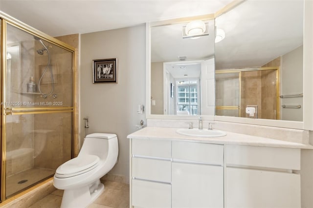 16711 Collins Ave Unit 704, Sunny Isles Beach, FL 33160 - bathroom featuring a stall shower, vanity, tile patterned floors, and toilet